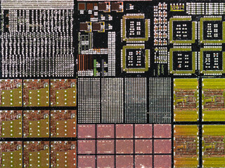 macro photography of semiconductor chip circuit with colorful reflection
