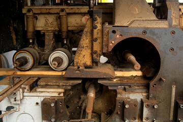 Industrial machine cutting wooden plank in lumber mill factory workshop. Wood manufacturing carpentry on plant, timber industry. Many broken metal details parts. Woodworking production manufacturing.
