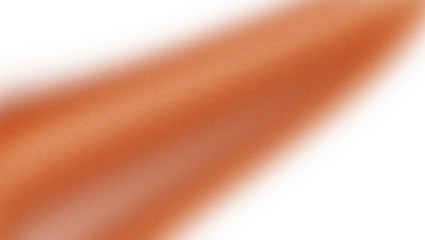 Close-up textured surface with orange and brown hues illuminated by a diagonal light source