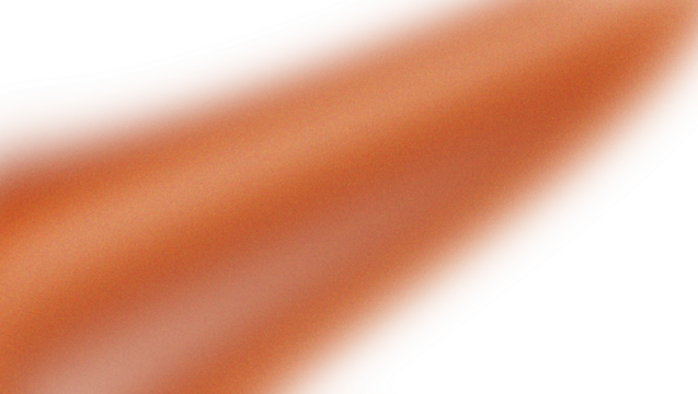 Close-up textured surface with orange and brown hues illuminated by a diagonal light source