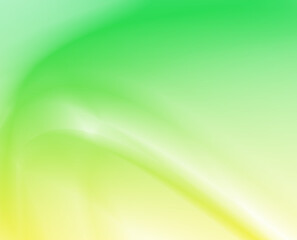 Abstract green and yellow swirling gradient background with soft light effects