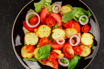 Panzanella salad tomato, croutons, onions vegetables dish natural product tasty snack fresh delicious gourmet food background on the table rustic top view copy space