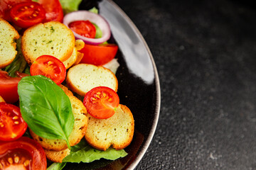 Panzanella salad tomato, croutons, onions vegetables dish natural product tasty snack fresh delicious gourmet food background on the table rustic top view copy space