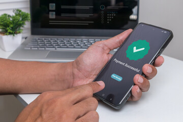 A man making payment for online shopping using his smartphone. Digital online payment and financial transaction success concept.