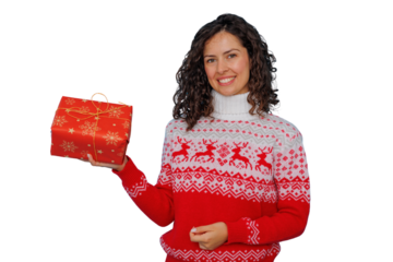 Woman smiling, holding a red christmas present, wearing festive holiday sweater on transparent background
