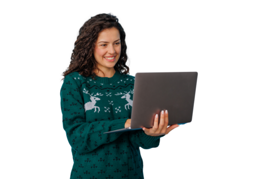 Woman smiling, holding laptop, shopping online during holiday season, wearing christmas sweater, transparent background