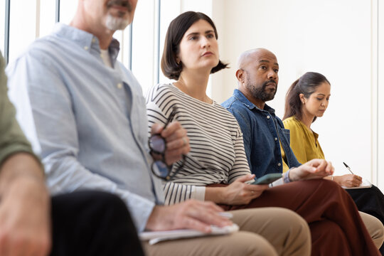 Diverse Group listening to a business conference