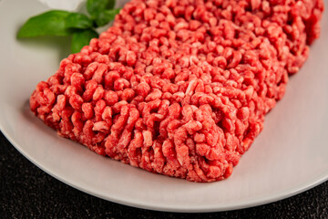 Raw minced meat beef pork ground meat natural product tasty snack fresh delicious gourmet food background on the table rustic top view copy space