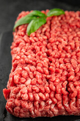 Raw minced meat beef pork ground meat natural product tasty snack fresh delicious gourmet food background on the table rustic top view copy space