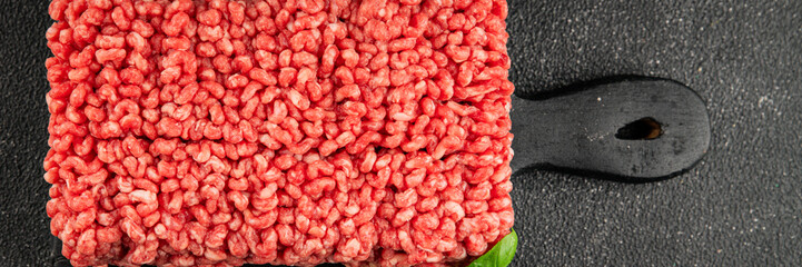 Raw minced meat beef pork ground meat natural product tasty snack fresh delicious gourmet food background on the table rustic top view copy space