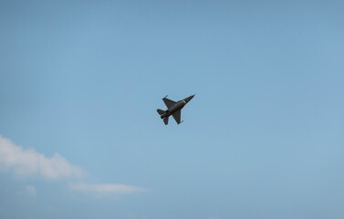 Flight of a military jet fighter F-16