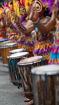 Row of Festival Drummers in Colorful Traditional Costumes During Street Parade