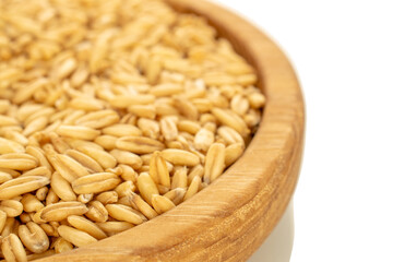 Raw oatmeal isolated on white background, close-up.
