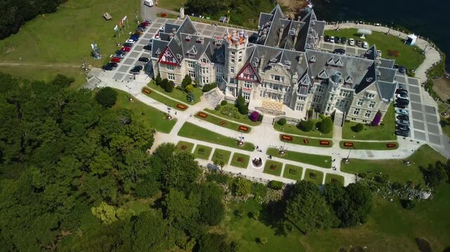 Aerial drone view of Magdalena Palace or Palacio de la Magdalena on the Magdalena Peninsula in Santander city, Spain