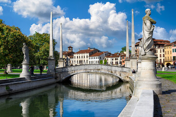View of canal with statues on square Prato della Valle in Padova (Padua), Veneto, Italy....