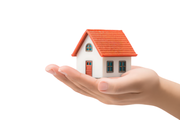 Hand Holding Small White House Model with Red Roof