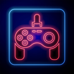 Glowing neon Gamepad icon isolated on black background. Game controller. Vector