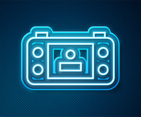 Glowing neon line Portable video game console icon isolated on blue background. Handheld console gaming. Vector