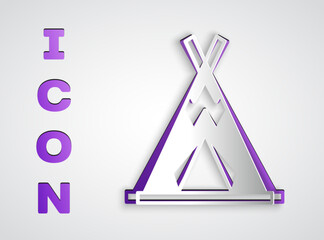 Paper cut Traditional indian teepee or wigwam icon isolated on grey background. Indian tent. Paper art style. Vector © Kostiantyn