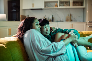 Female couple watching a movie together