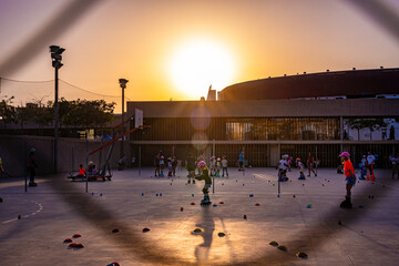 Children Roller Skating at Sunset Outdoors
