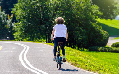 Fototapeta premium Cyclist ride on the bike path in the city Park 