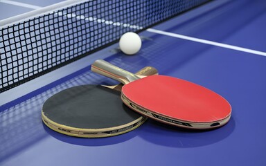 Close up shot of table tennis rackets ball and net on bright blue sports court