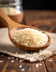 Wooden spoon full of rice