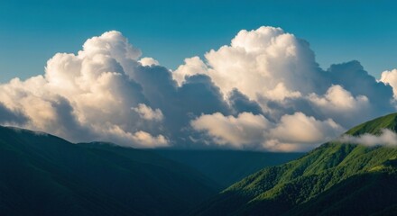 Vast clouds over lush mountain range