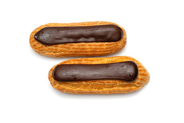 Two chocolate eclairs with chocolate on a white background
