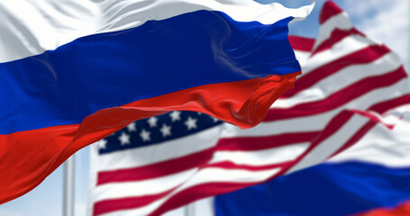 Russian and American flags waving side by side in wind. 3D render