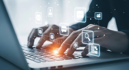 Hands typing on laptop with social media and communication icons computer keyboard