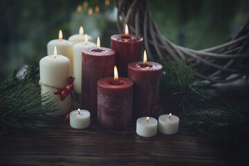 Ceremonial scene with burning candles. Traditionally luminous symbol of holidays and all saints' day. Background with a peaceful and tranquil atmosphere. Space for text.