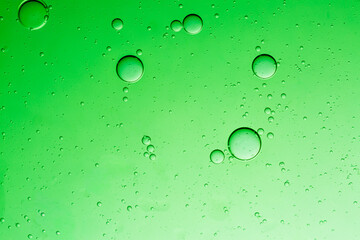 Close-up macro green drink bubbles,Water wave, close up of vibrant green liquid with bubbles,...