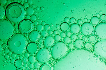 Close-up macro green drink bubbles,Water wave, close up of vibrant green liquid with bubbles,...