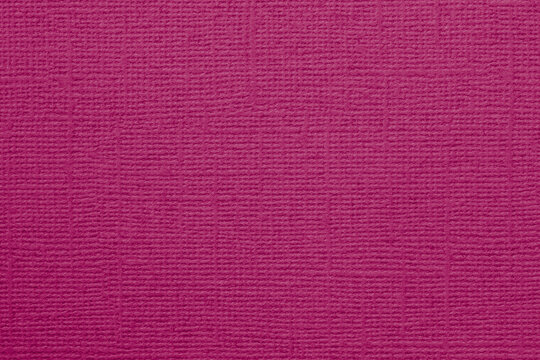 Elegant raspberry pink textured background with smooth matte finish and subtle woven pattern. Concept of trendy stylish, bold and premium design, copy space