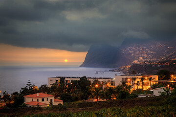 Dramatic sunset under stormy clouds at Sao Martinho on th ePortuguese island of Madeira.