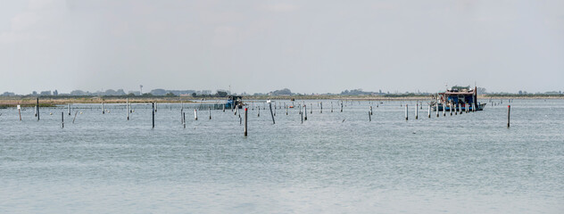 floating fish farms, Porto Caleri passage, Italy