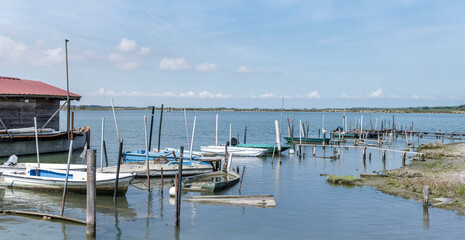 boats and moorings, Porto Caleri harbor, Italy