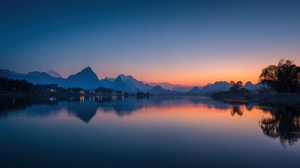 Fototapeta premium The magnificent scenery of the lake, with the mountains reflecting symmetrically on the water's surface, brings tranquility and harmony to the entire landscape.