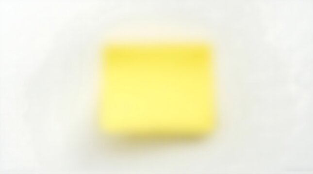 Soft Focus Yellow Square Sticky Note on Blurry White Background