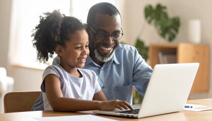 Obraz premium Young girl and grandfather sitting at a desk, looking at a laptop. Two generations using technology together
