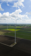 Renewable energy from wind, clean energy, wind turbines in open fields, green electricity.