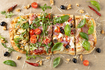 Traditional pinsa with 4 flavors. View from above. Top view.