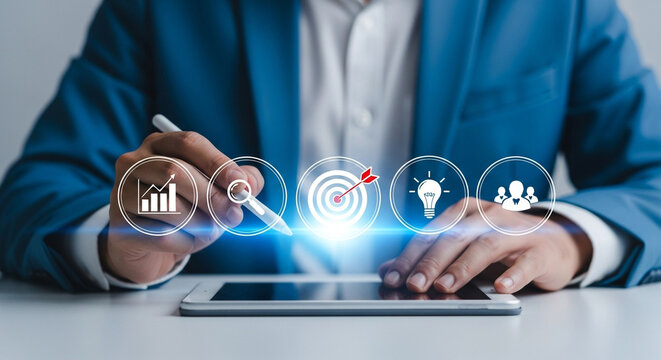 Businessman using digital pen on tablet with business icons, representing strategy, goal, idea and teamwork