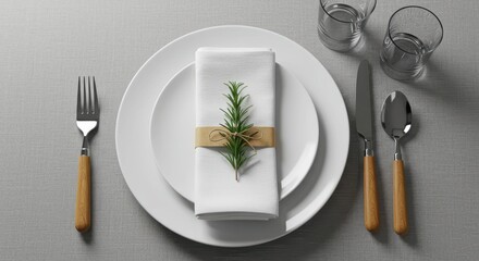 Elegant table setting with white plates, linen napkins, wooden cutlery, and a sprig of rosemary.
