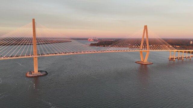 Arthur Ravenel Jr Bridge cars driving over Cooper River 4K aerial drone shot Charleston South Carolina at sunset