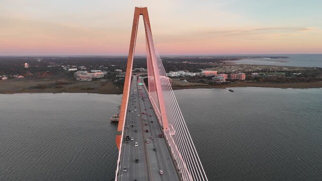 Arthur Ravenel Jr Bridge cars driving over Cooper River at sunset 4K aerial drone shot Charleston South Carolina