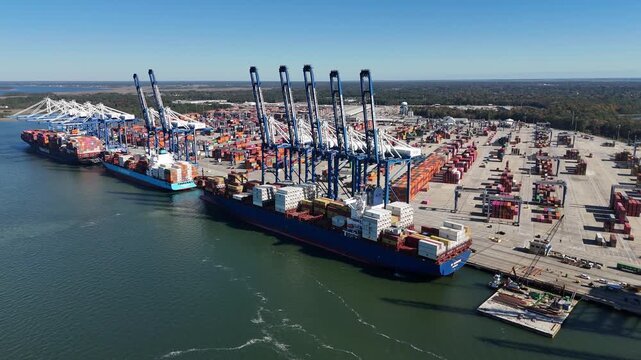Port of Charleston South Carolina container terminal cranes and cargo ships 4K aerial drone shot 