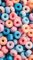 Fototapeta premium Soft pastel colored small round beads in a close up pile, suggesting creativity and crafting ideas for jewelry making.